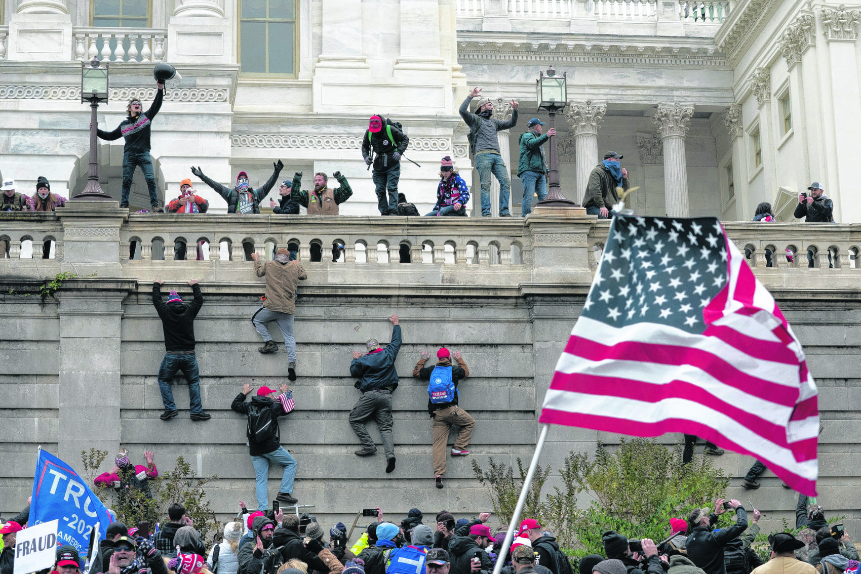 jose luis magana ap rioters scale a wall at the u s capitol on jan 6 ...